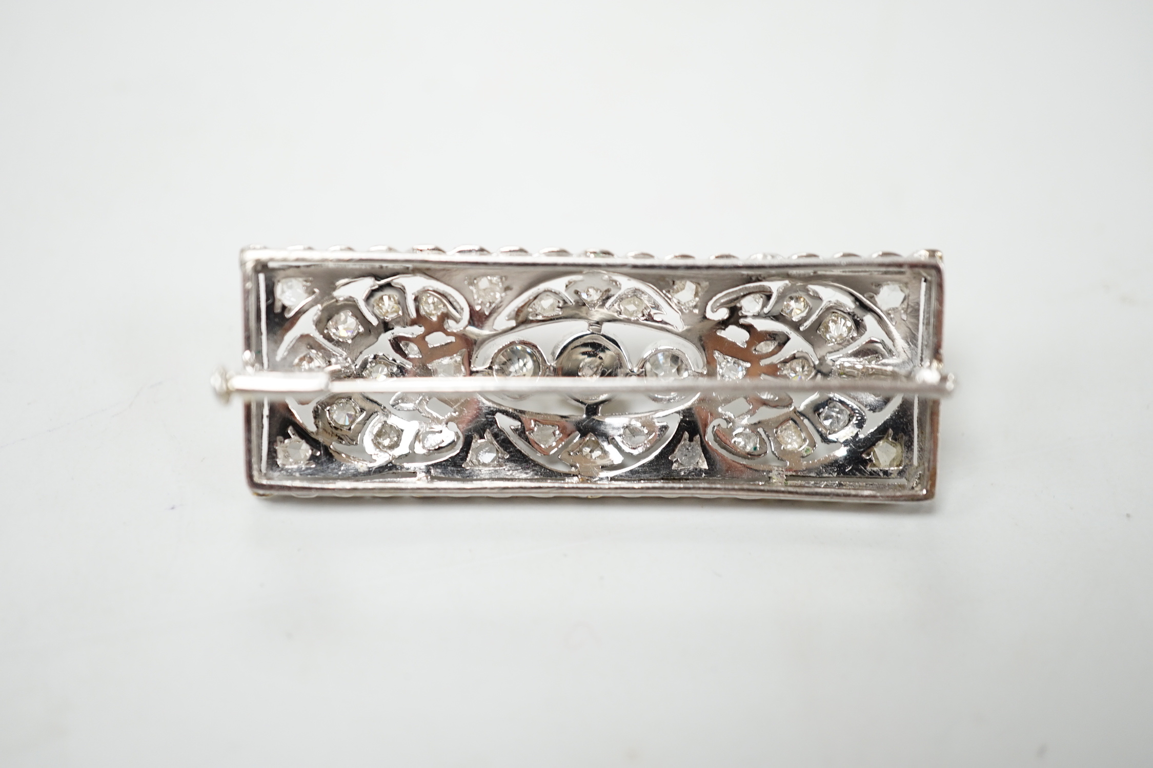 A 1920's white metal, pearl and diamond cluster set rectangular brooch, 43mm, gross weight 5.8 grams.